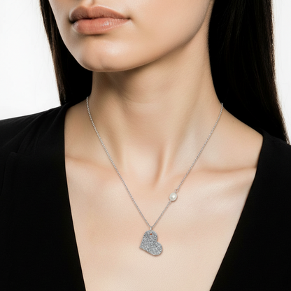 Necklace with a heart-shaped pendant worn by a model against a plain background